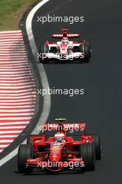 21.10.2007 Sao Paulo, Brazil,  Kimi Raikkonen (FIN), Räikkönen, Scuderia Ferrari, Takuma Sato (JPN), Super Aguri F1 - Formula 1 World Championship, Rd 17, Brazilian Grand Prix, Sunday Race