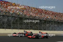 21.10.2007 Sao Paulo, Brazil,  Fernando Alonso (ESP), McLaren Mercedes, MP4-22 and Lewis Hamilton (GBR), McLaren Mercedes, MP4-22 - Formula 1 World Championship, Rd 17, Brazilian Grand Prix, Sunday Race