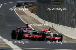 20.10.2007 Sao Paulo, Brazil,  Fernando Alonso (ESP), McLaren Mercedes passes Lewis Hamilton (GBR), McLaren Mercedes rolls towards the pits - Formula 1 World Championship, Rd 17, Brazilian Grand Prix, Saturday Qualifying