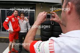 18.10.2007 Sao Paulo, Brazil,  Fernando Alonso (ESP), McLaren Mercedes with Ferrari Mechanics - Formula 1 World Championship, Rd 17, Brazilian Grand Prix, Thursday