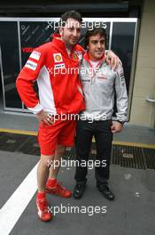 18.10.2007 Sao Paulo, Brazil,  Fernando Alonso (ESP), McLaren Mercedes and a Scuderia Ferrari Mechanic - Formula 1 World Championship, Rd 17, Brazilian Grand Prix, Thursday