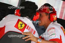 08.06.2007 Montreal, Canada,  Michael Schumacher (GER), Scuderia Ferrari, Advisor and Luca Baldisserri (ITA), Head of Trackside Operations - Formula 1 World Championship, Rd 6, Canadian Grand Prix, Friday Practice