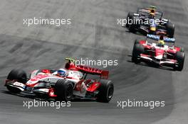 10.06.2007 Montreal, Canada,  Anthony Davidson (GBR), Super Aguri F1 Team, SA07 and Ralf Schumacher (GER), Toyota Racing, TF107 - Formula 1 World Championship, Rd 6, Canadian Grand Prix, Sunday Race