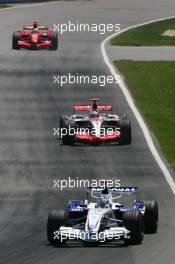 10.06.2007 Montreal, Canada,  Nick Heidfeld (GER), BMW Sauber F1 Team, F1.07 and Fernando Alonso (ESP), McLaren Mercedes, MP4-22 - Formula 1 World Championship, Rd 6, Canadian Grand Prix, Sunday Race