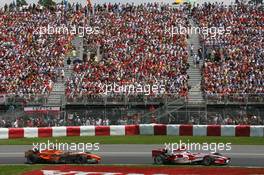 10.06.2007 Montreal, Canada,  Takuma Sato (JPN), Super Aguri F1, SA07 and Christijan Albers (NED), Spyker F1 Team, F8-VII - Formula 1 World Championship, Rd 6, Canadian Grand Prix, Sunday Race