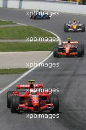 10.06.2007 Montreal, Canada,  Kimi Raikkonen (FIN), Räikkönen, Scuderia Ferrari, F2007 and Christijan Albers (NED), Spyker F1 Team, F8-VII - Formula 1 World Championship, Rd 6, Canadian Grand Prix, Sunday Race