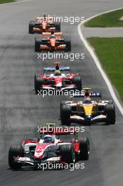 10.06.2007 Montreal, Canada,  Anthony Davidson (GBR), Super Aguri F1 Team, SA07 and Heikki Kovalainen (FIN), Renault F1 Team, R27 - Formula 1 World Championship, Rd 6, Canadian Grand Prix, Sunday Race