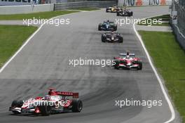 10.06.2007 Montreal, Canada,  Takuma Sato (JPN), Super Aguri F1, SA07 and Jarno Trulli (ITA), Toyota Racing, TF107 - Formula 1 World Championship, Rd 6, Canadian Grand Prix, Sunday Race