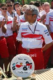 10.06.2007 Montreal, Canada,  A cake is presented to Tsutomu Tomita (JPN), Toyota Racing Chairman and Team Principal, as he leaves the Toyota team to take the position of Chairman of the Fuji Speedway in Japan - Formula 1 World Championship, Rd 6, Canadian Grand Prix, Sunday