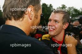 07.10.2007 Shanghai, China,  Sebastian Vettel (GER), Scuderia Toro Rosso and Gerhard Berger (AUT), Scuderia Toro Rosso, 50% Team Co Owner celebrate after finished 4th - Formula 1 World Championship, Rd 16, Chinese Grand Prix, Sunday Podium