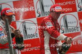 07.10.2007 Shanghai, China,  2nd place Fernando Alonso (ESP), McLaren Mercedes and 1st place Kimi Raikkonen (FIN), Räikkönen, Scuderia Ferrari - Formula 1 World Championship, Rd 16, Chinese Grand Prix, Sunday Podium