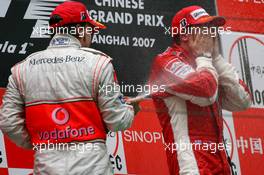 07.10.2007 Shanghai, China,  2nd place Fernando Alonso (ESP), McLaren Mercedes and 1st place Kimi Raikkonen (FIN), Räikkönen, Scuderia Ferrari - Formula 1 World Championship, Rd 16, Chinese Grand Prix, Sunday Podium