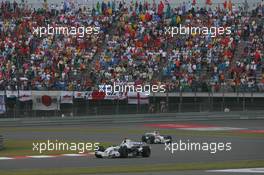 07.10.2007 Shanghai, China,  Nick Heidfeld (GER), BMW Sauber F1 Team, F1.07 leads Robert Kubica (POL), BMW Sauber F1 Team, F1.07 - Formula 1 World Championship, Rd 16, Chinese Grand Prix, Sunday Race