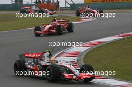 07.10.2007 Shanghai, China,  Lewis Hamilton (GBR), McLaren Mercedes, MP4-22 leads Kimi Raikkonen (FIN), Räikkönen, Scuderia Ferrari, F2007 and Felipe Massa (BRA), Scuderia Ferrari, F2007 - Formula 1 World Championship, Rd 16, Chinese Grand Prix, Sunday Race