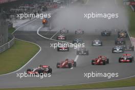 07.10.2007 Shanghai, China,  Lewis Hamilton (GBR), McLaren Mercedes leads the start of the race - Formula 1 World Championship, Rd 16, Chinese Grand Prix, Sunday Race