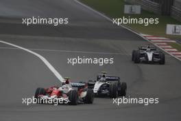 07.10.2007 Shanghai, China,  Jarno Trulli (ITA), Toyota Racing, TF107 leads Alexander Wurz (AUT), Williams F1 Team, FW29 - Formula 1 World Championship, Rd 16, Chinese Grand Prix, Sunday Race