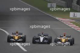 07.10.2007 Shanghai, China,  Heikki Kovalainen (FIN), Renault F1 Team, R27 with Nico Rosberg (GER), WilliamsF1 Team, FW29 and Giancarlo Fisichella (ITA), Renault F1 Team, R27 go side by side - Formula 1 World Championship, Rd 16, Chinese Grand Prix, Sunday Race