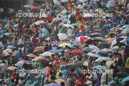 07.10.2007 Shanghai, China,  Fans with umbrellas in the rain - Formula 1 World Championship, Rd 16, Chinese Grand Prix, Sunday Race