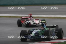 07.10.2007 Shanghai, China,  Rubens Barrichello (BRA), Honda Racing F1 Team, RA107 and Takuma Sato (JPN), Super Aguri F1, SA07 - Formula 1 World Championship, Rd 16, Chinese Grand Prix, Sunday Race