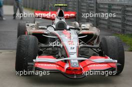 07.10.2007 Shanghai, China,  Lewis Hamilton's (GBR), McLaren Mercedes parked at the side of the track with badly worn tyres - Formula 1 World Championship, Rd 16, Chinese Grand Prix, Sunday Race