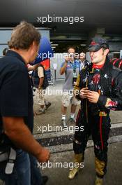 07.10.2007 Shanghai, China,  Vitantonio Liuzzi (ITA), Scuderia Toro Rosso is covered in water while talking to Gerhard Berger (AUT), Scuderia Toro Rosso, 50% Team Co Owner after he finished 6th in the race - Formula 1 World Championship, Rd 16, Chinese Grand Prix, Sunday