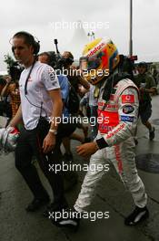 07.10.2007 Shanghai, China,  Lewis Hamilton (GBR), McLaren Mercedes, returns to the paddock after retiring from the race - Formula 1 World Championship, Rd 16, Chinese Grand Prix, Sunday