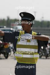 04.10.2007 Shanghai, China,  A traffic Warden - Formula 1 World Championship, Rd 16, Chinese Grand Prix, Thursday