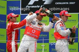 13.05.2007 Barcelona, Spain,  1st place Felipe Massa (BRA), Scuderia Ferrari with 2nd place Lewis Hamilton (GBR), McLaren Mercedes and 3rd place Fernando Alonso (ESP), McLaren Mercedes - Formula 1 World Championship, Rd 4, Spanish Grand Prix, Sunday Podium