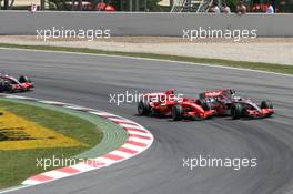 13.05.2007 Barcelona, Spain,  Start, Felipe Massa (BRA), Scuderia Ferrari, F2007, Fernando Alonso (ESP), McLaren Mercedes, MP4-22, Lewis Hamilton (GBR), McLaren Mercedes, MP4-22, Kimi Raikkonen (FIN), Räikkönen, Scuderia Ferrari, F2007 - Formula 1 World Championship, Rd 4, Spanish Grand Prix, Sunday Race