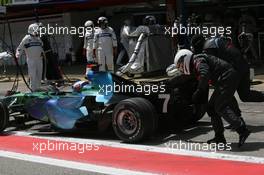 13.05.2007 Barcelona, Spain,  Jenson Button (GBR), Honda Racing F1 Team, RA107 gets a push after his pit stop - Formula 1 World Championship, Rd 4, Spanish Grand Prix, Sunday Race