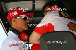 12.05.2007 Barcelona, Spain,  Michael Schumacher (GER), Scuderia Ferrari, Advisor talks with Chris Dyer (AUS), Scuderia Ferrari, Track Engineer of Kimi Raikkonen (FIN) on the pit wall - Formula 1 World Championship, Rd 4, Spanish Grand Prix, Saturday Qualifying