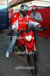 12.05.2007 Barcelona, Spain,  Michael Schumacher (GER), Scuderia Ferrari, Advisor leaves the track on a Ducati - Formula 1 World Championship, Rd 4, Spanish Grand Prix, Saturday