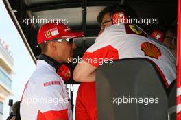 12.05.2007 Barcelona, Spain,  Michael Schumacher (GER), Scuderia Ferrari, Advisor talks with Chris Dyer (AUS), Scuderia Ferrari, Track Engineer of Kimi Raikkonen (FIN) on the pit wall - Formula 1 World Championship, Rd 4, Spanish Grand Prix, Saturday Qualifying