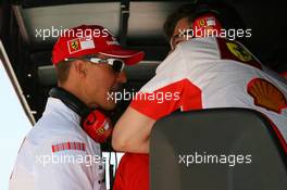 12.05.2007 Barcelona, Spain,  Michael Schumacher (GER), Scuderia Ferrari, Advisor talks with Chris Dyer (AUS), Scuderia Ferrari, Track Engineer of Kimi Raikkonen (FIN) on the pit wall - Formula 1 World Championship, Rd 4, Spanish Grand Prix, Saturday Qualifying