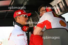 12.05.2007 Barcelona, Spain,  Michael Schumacher (GER), Scuderia Ferrari, Advisor talks with Chris Dyer (AUS), Scuderia Ferrari, Track Engineer of Kimi Raikkonen (FIN) on the pit wall - Formula 1 World Championship, Rd 4, Spanish Grand Prix, Saturday Qualifying