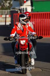 12.05.2007 Barcelona, Spain,  Michael Schumacher (GER), Scuderia Ferrari, Advisor leaves the track on a Ducati - Formula 1 World Championship, Rd 4, Spanish Grand Prix, Saturday