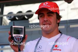 10.05.2007 Barcelona, Spain,  Fernando Alonso (ESP), McLaren Mercedes, with a team branded Kangaroo TV Set - Formula 1 World Championship, Rd 4, Spanish Grand Prix, Thursday