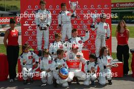 10.05.2007 Barcelona, Spain,  Fernando Alonso (ESP), McLaren Mercedes, with the young Go-Karters - Vodafone Spain Go-Karting Challenge with Fernando Alonso (ESP), McLaren Mercedes - Formula 1 World Championship, Rd 4, Spanish Grand Prix, Thursday