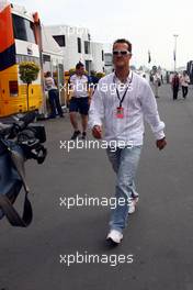 20.07.2007 Nürburg, Germany,  Michael Schumacher (GER), Scuderia Ferrari, Advisor arrives at the track on begin of the first training session - Formula 1 World Championship, Rd 10, European Grand Prix, Friday