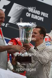 22.07.2007 Nürburg, Germany,  Michael Schumacher (GER), Scuderia Ferrari, Advisor hands Ron Dennis (GBR), McLaren, Team Principal, Chairman a trophy - Formula 1 World Championship, Rd 10, European Grand Prix, Sunday Podium