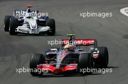 22.07.2007 Nürburg, Germany,  Lewis Hamilton (GBR), McLaren Mercedes, MP4-22 and Nick Heidfeld (GER), BMW Sauber F1 Team, F1.07 - Formula 1 World Championship, Rd 10, European Grand Prix, Sunday Race