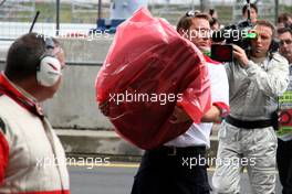 21.07.2007 Nürburg, Germany,  Tyre from the car of Lewis Hamilton (GBR), McLaren Mercedes is recovered after crashing heavily - Formula 1 World Championship, Rd 10, European Grand Prix, Saturday Qualifying