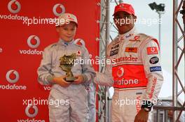 19.07.2007 Nürburg, Germany,  Lewis Hamilton (GBR), McLaren Mercedes, with a young karter, Vodafone Karting Event - Formula 1 World Championship, Rd 10, European Grand Prix, Thursday