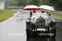 19.07.2007 Nürburg, Germany,  Fernando Alonso (ESP), McLaren Mercedes and Lewis Hamilton (GBR), McLaren Mercedes with a historic Mercedes S from 1927, in the rain - Formula 1 World Championship, Rd 10, European Grand Prix, Thursday