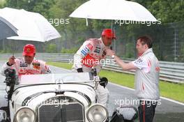 19.07.2007 Nürburg, Germany,  Fernando Alonso (ESP), McLaren Mercedes and Lewis Hamilton (GBR), McLaren Mercedes with a historic Mercedes S from 1927, in the rain - Formula 1 World Championship, Rd 10, European Grand Prix, Thursday