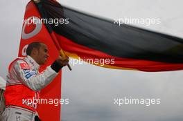 19.07.2007 Nürburg, Germany,  Lewis Hamilton (GBR), McLaren Mercedes, Vodafone Karting Event, waves the German national flag - Formula 1 World Championship, Rd 10, European Grand Prix, Thursday