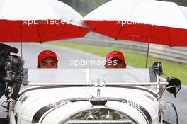 19.07.2007 Nürburg, Germany,  Fernando Alonso (ESP), McLaren Mercedes and Lewis Hamilton (GBR), McLaren Mercedes with a historic Mercedes S from 1927, in the rain - Formula 1 World Championship, Rd 10, European Grand Prix, Thursday