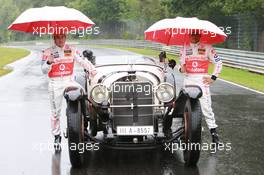 19.07.2007 Nürburg, Germany,  Fernando Alonso (ESP), McLaren Mercedes and Lewis Hamilton (GBR), McLaren Mercedes with a historic Mercedes S from 1927, in the rain - Formula 1 World Championship, Rd 10, European Grand Prix, Thursday