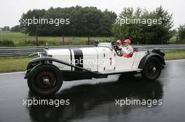 19.07.2007 Nürburg, Germany,  Fernando Alonso (ESP), McLaren Mercedes and Lewis Hamilton (GBR), McLaren Mercedes with a historic Mercedes S from 1927 - Formula 1 World Championship, Rd 10, European Grand Prix, Thursday