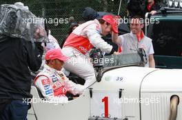 19.07.2007 Nürburg, Germany,  Fernando Alonso (ESP), McLaren Mercedes and Lewis Hamilton (GBR), McLaren Mercedes with a historic Mercedes S from 1927, in the rain - Formula 1 World Championship, Rd 10, European Grand Prix, Thursday